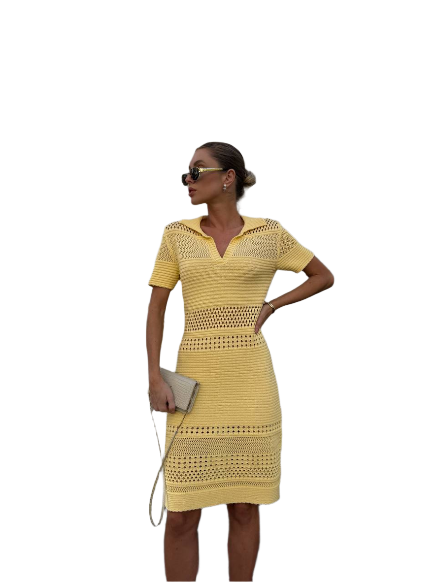 Woman wearing a yellow dress with a white background