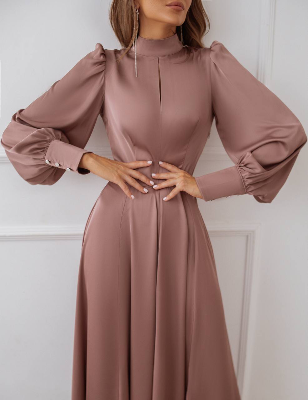 Mauve dress with long sleeves on a white background