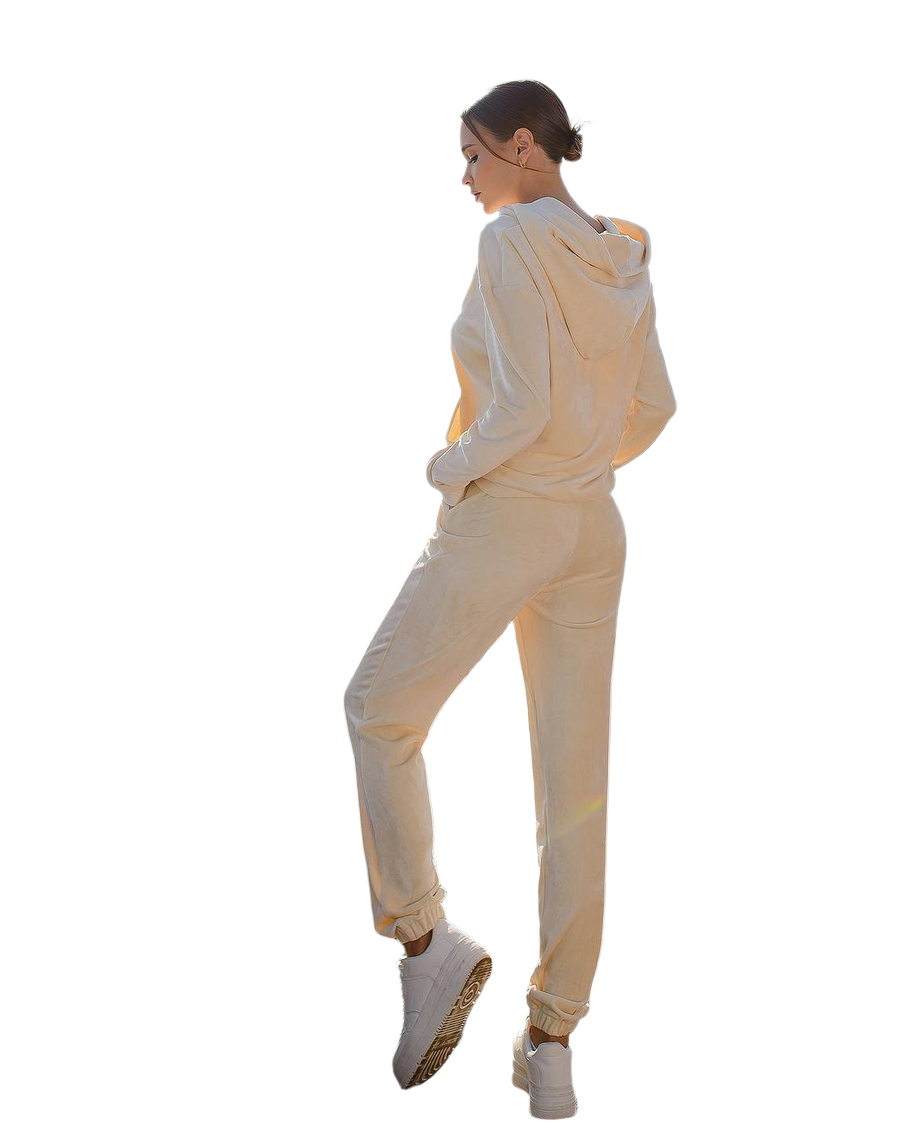 Person wearing a beige tracksuit on a white background