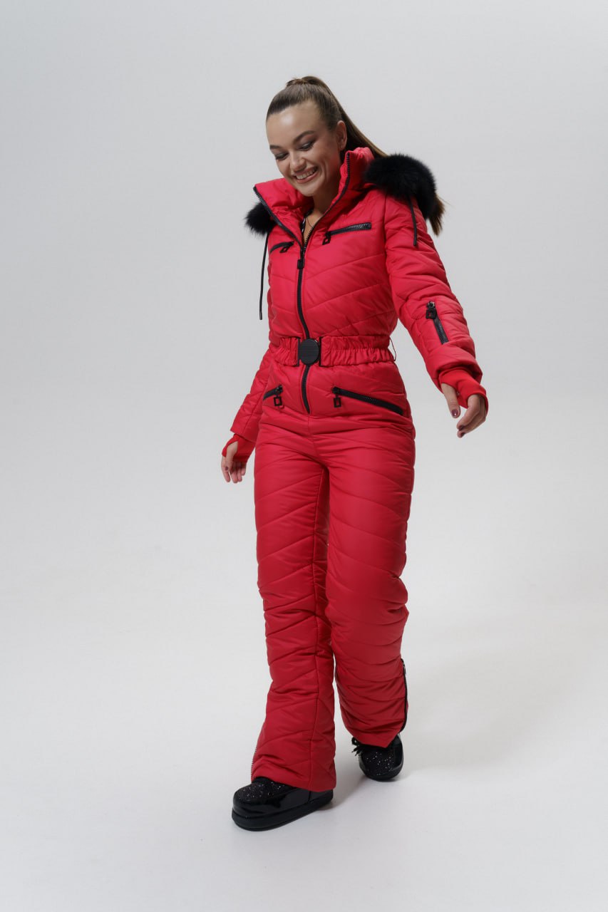Person wearing a red snowsuit on a white background