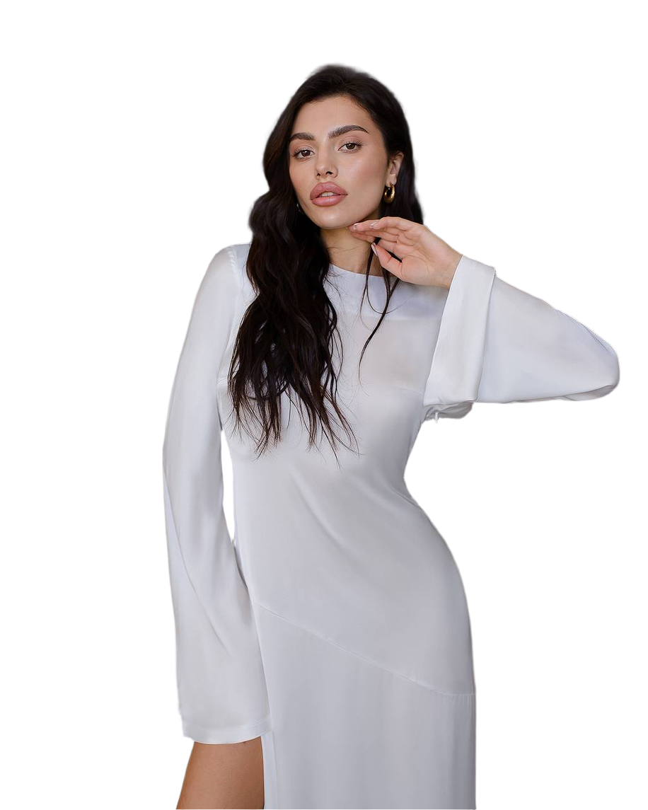 Woman wearing a white dress with sheer sleeves on a white background