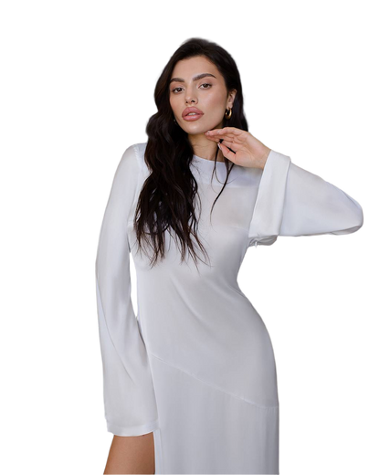 Woman wearing a white dress with sheer sleeves on a white background