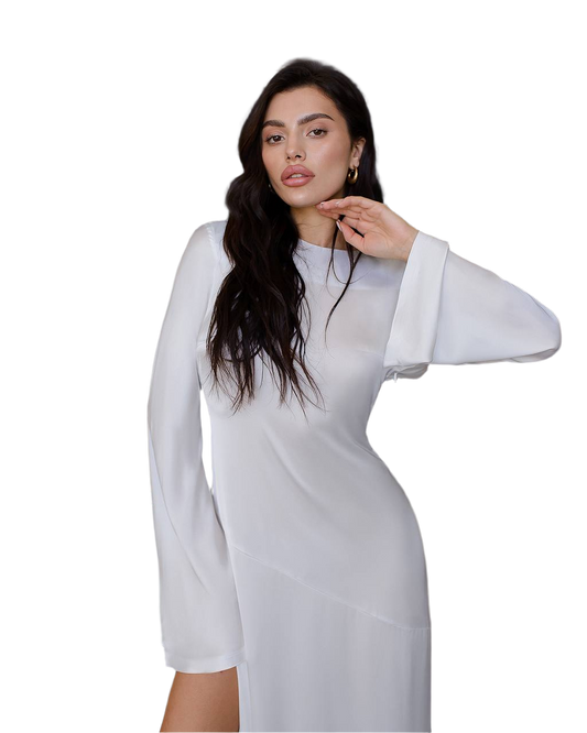 Woman wearing a white dress with sheer sleeves on a white background