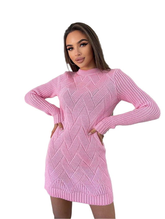 Woman wearing a pink knitted dress on a white background