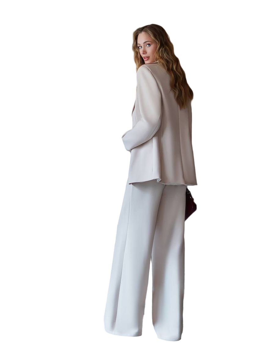 Woman wearing a beige blazer and white pants on a white background