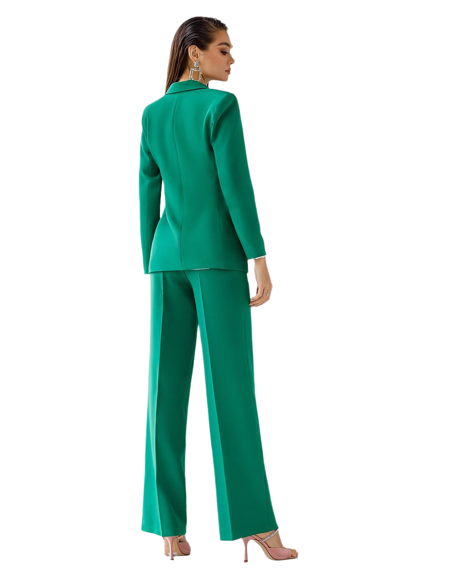 Woman wearing a green suit on a white background