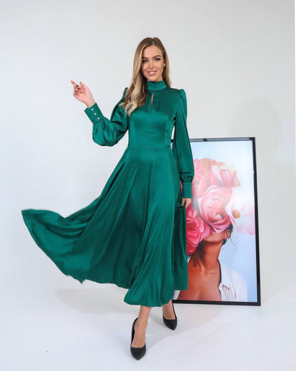 Woman wearing a green dress with a white background