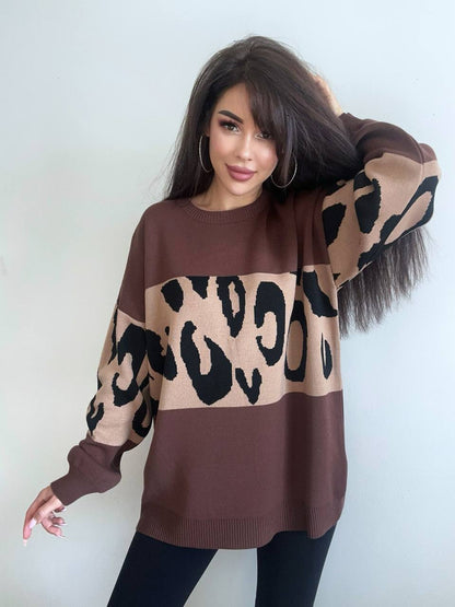 Woman wearing a brown sweater with leopard print pattern against a white background