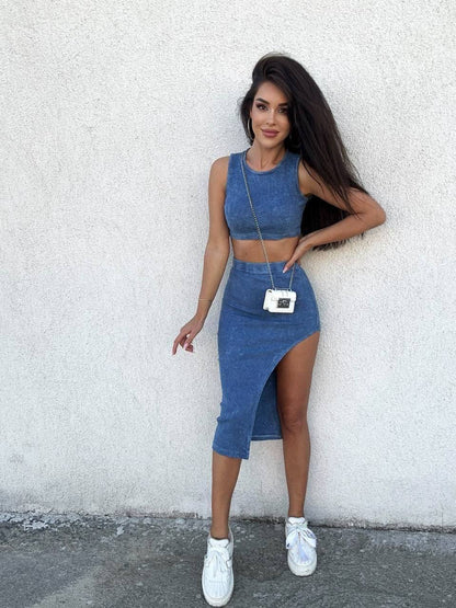 Woman wearing a blue denim outfit against a white wall