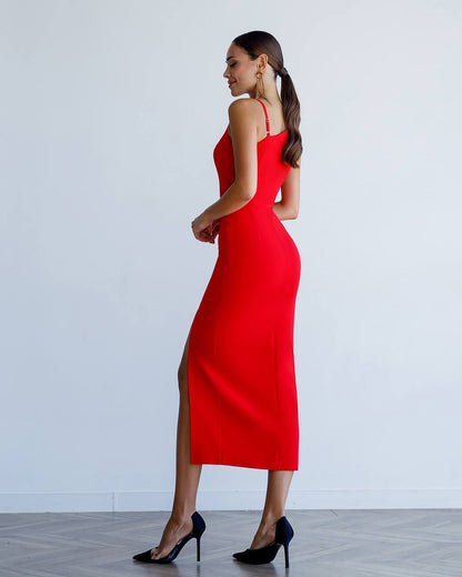 Woman wearing a red dress with a white background
