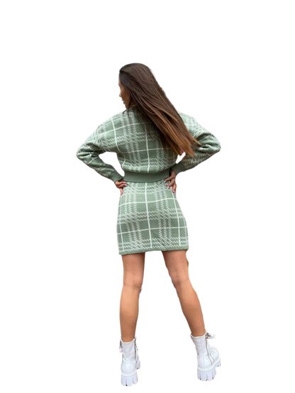 Woman wearing a green plaid outfit on a white background