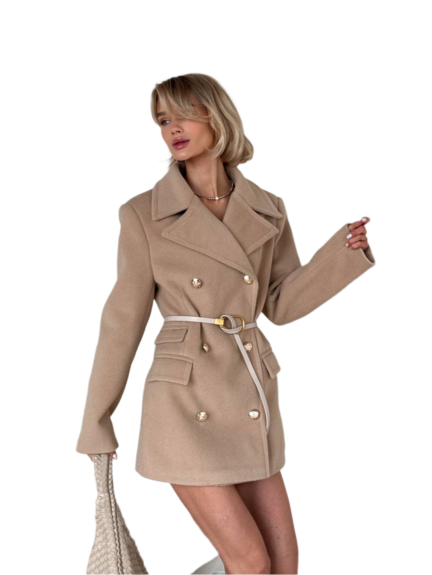 Woman wearing a beige trench coat on a white background
