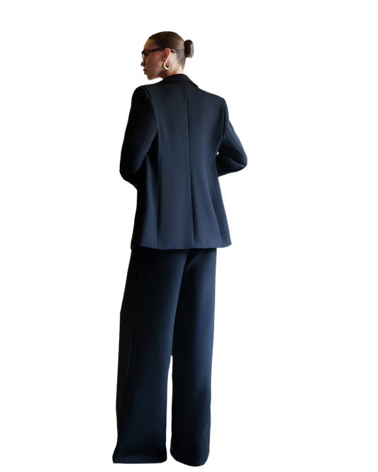 Person wearing a navy blue suit on a white background