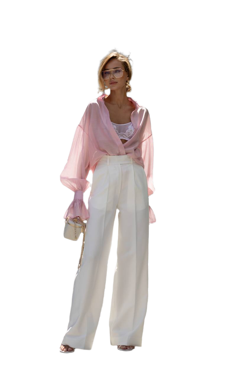 Person wearing a pink blouse and white pants on a white background