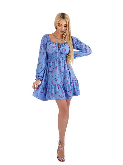 Woman wearing a blue floral dress on a white background