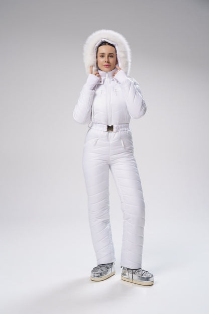 Person wearing a white puffer suit on a gray background