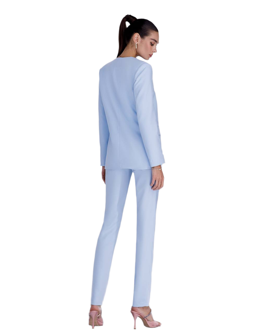 Woman wearing a light blue suit on a white background