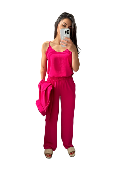 Woman wearing a bright pink outfit on a white background