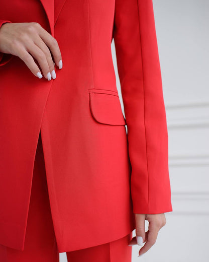 Red suit jacket worn by a person on a light gray background