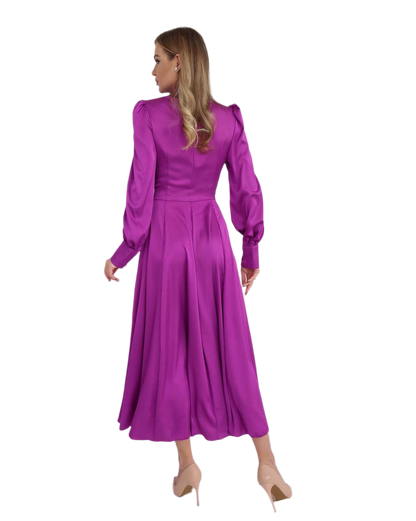 Purple dress worn by a model on a white background