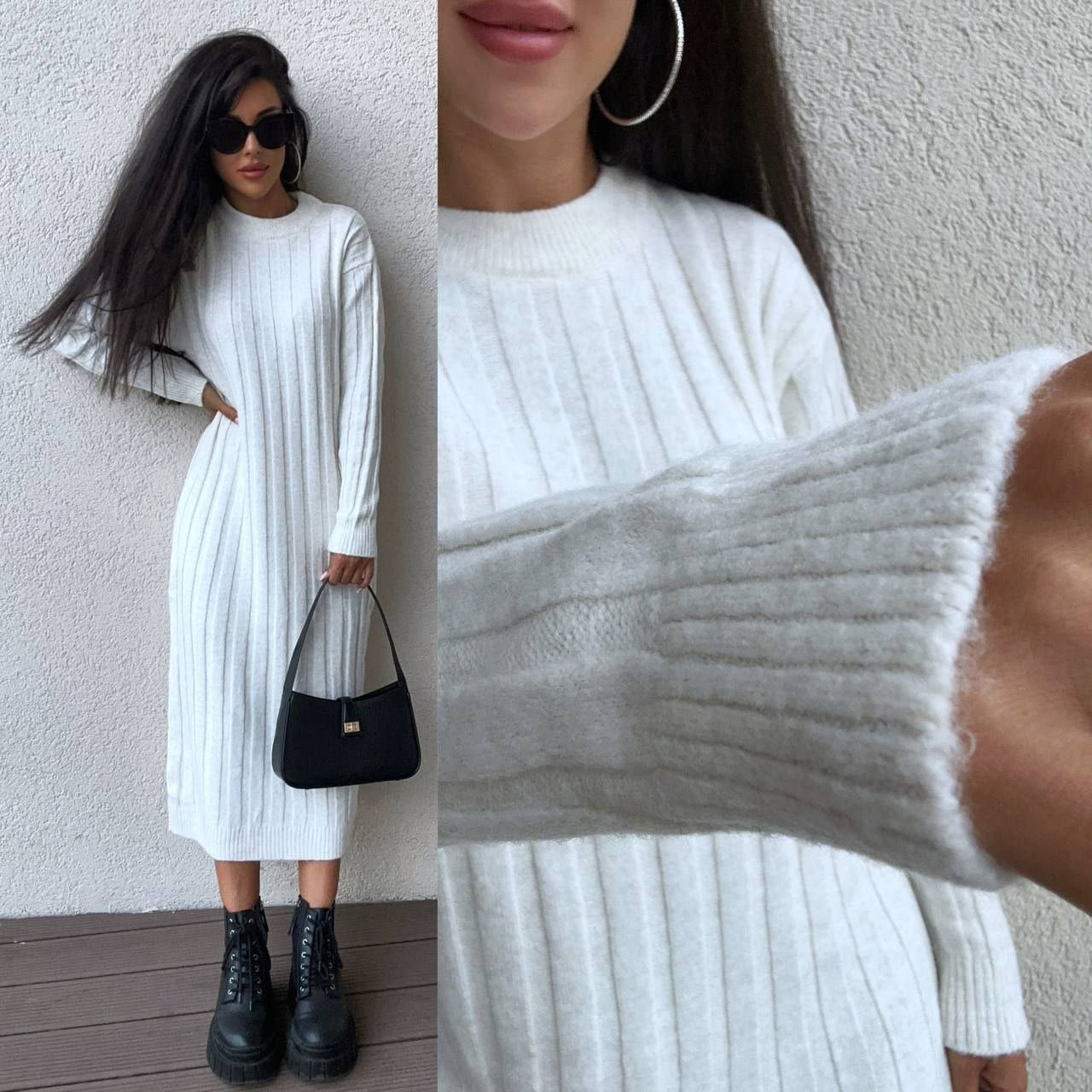 Woman wearing a white ribbed dress with close-up details against a neutral background