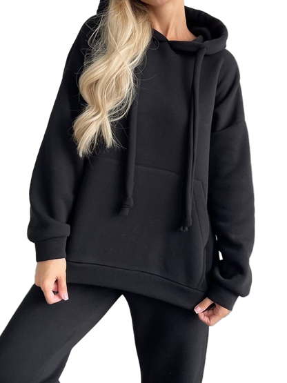 Person wearing a black hoodie on a white background