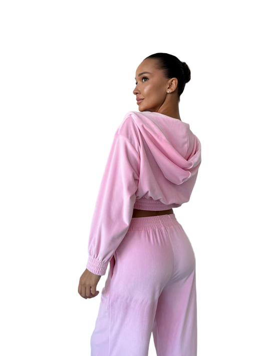 Woman wearing a pink outfit on a white background