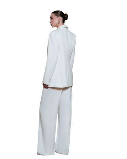 Person wearing a white suit on a white background