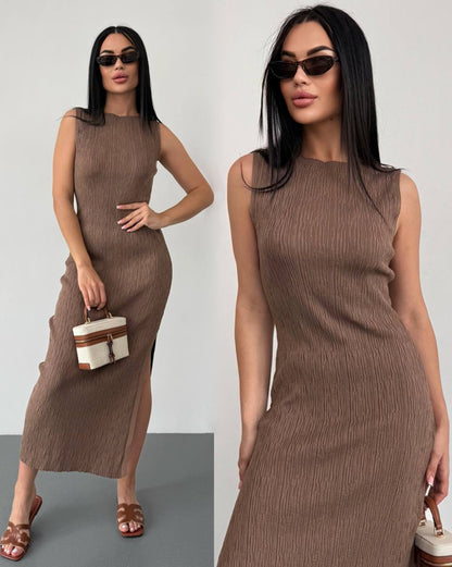 Woman wearing a brown sleeveless dress against a white background