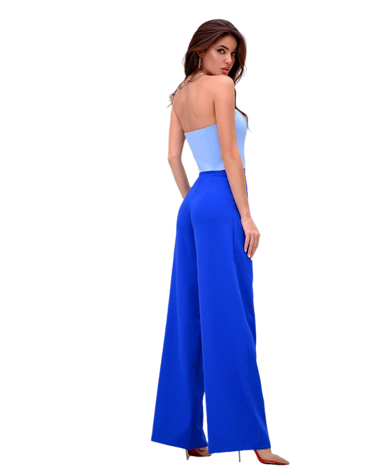 Woman wearing a blue and light blue strapless jumpsuit on a white background