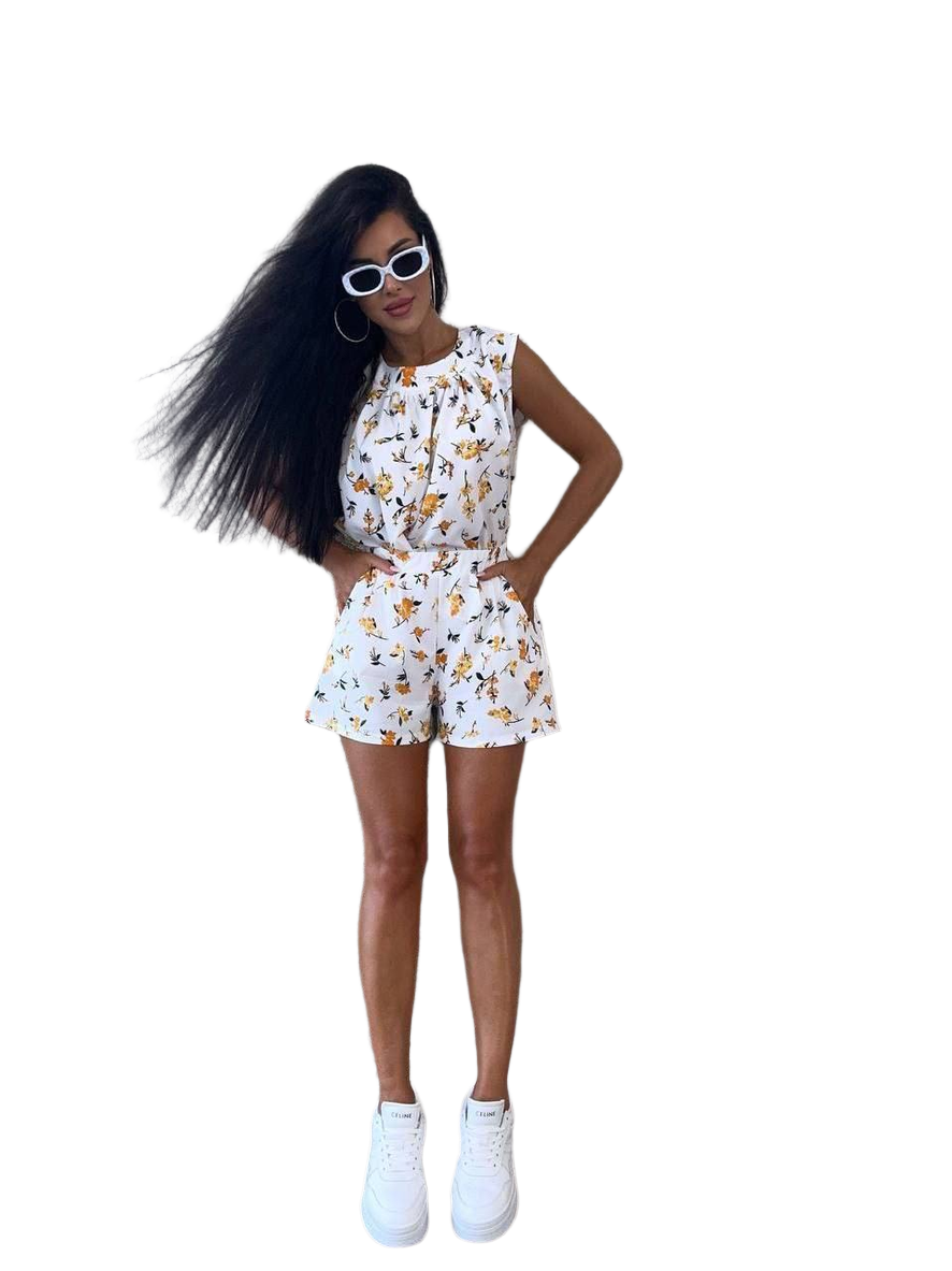 Woman wearing a floral outfit on a white background