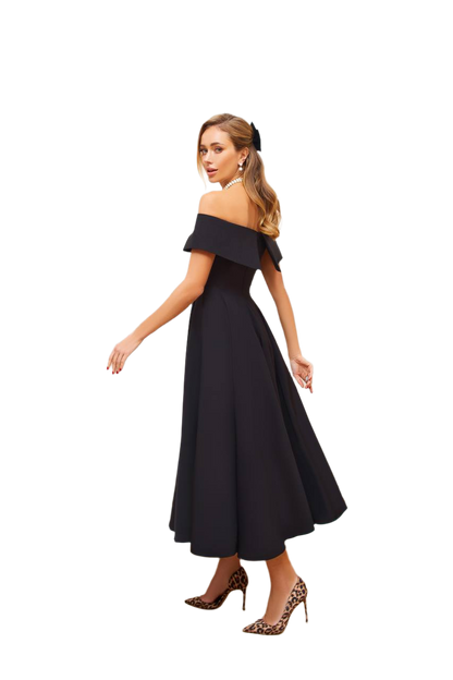 Woman wearing a black off-shoulder dress on a white background