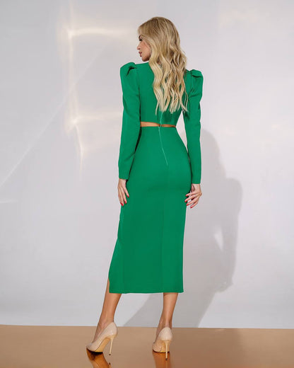 Woman wearing a green dress against a white background