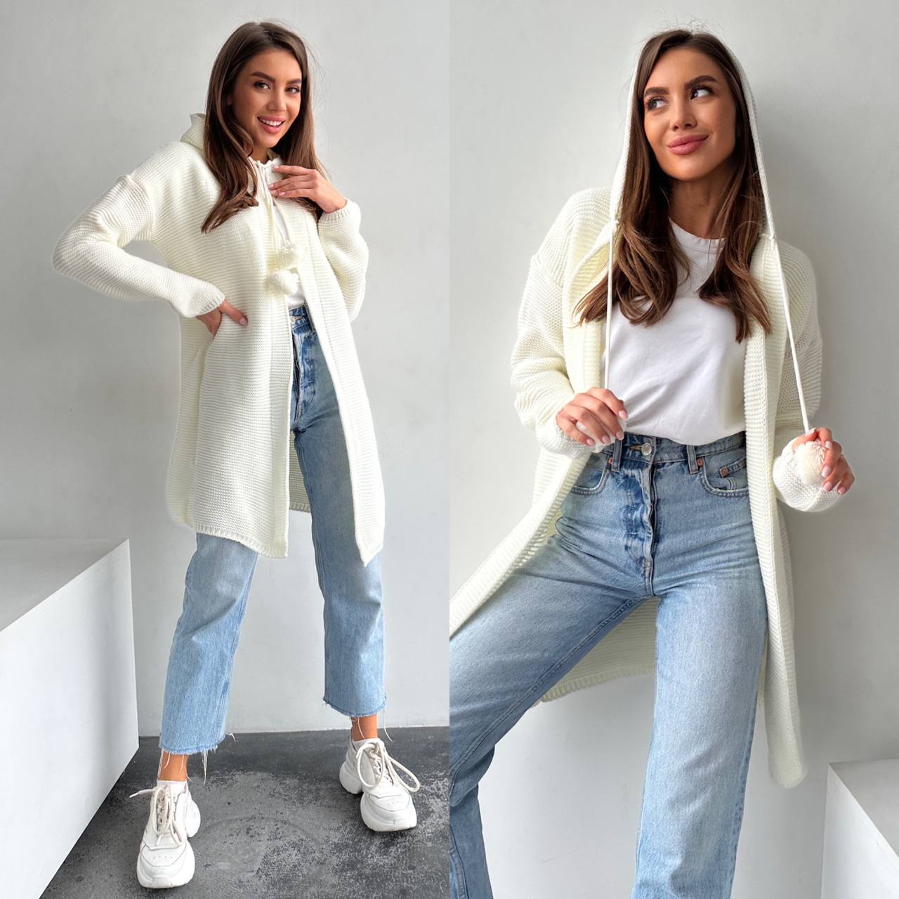Woman wearing a white coat, white shirt, and blue jeans on a plain background