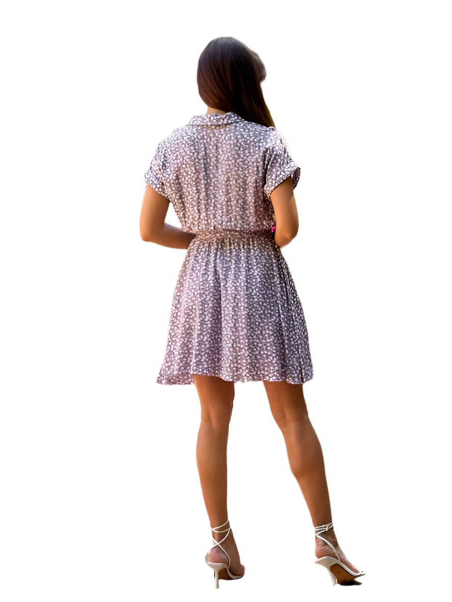 Woman wearing a patterned dress on a white background