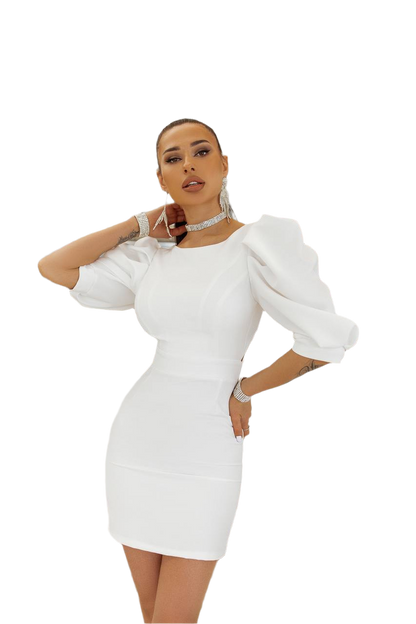 Woman wearing a white dress with puffed sleeves on a white background