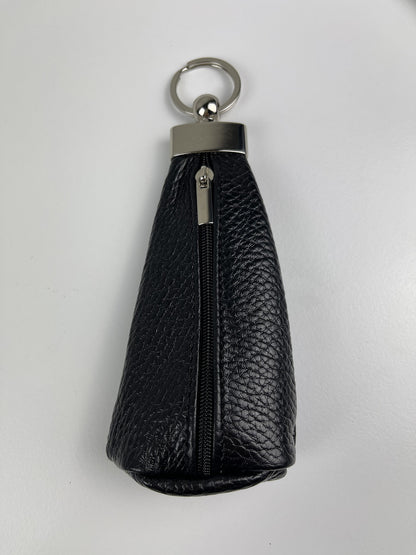 A black pebbled leather key pouch with a silver-tone metal ring, zipper, and cap, shown on a plain light gray background.