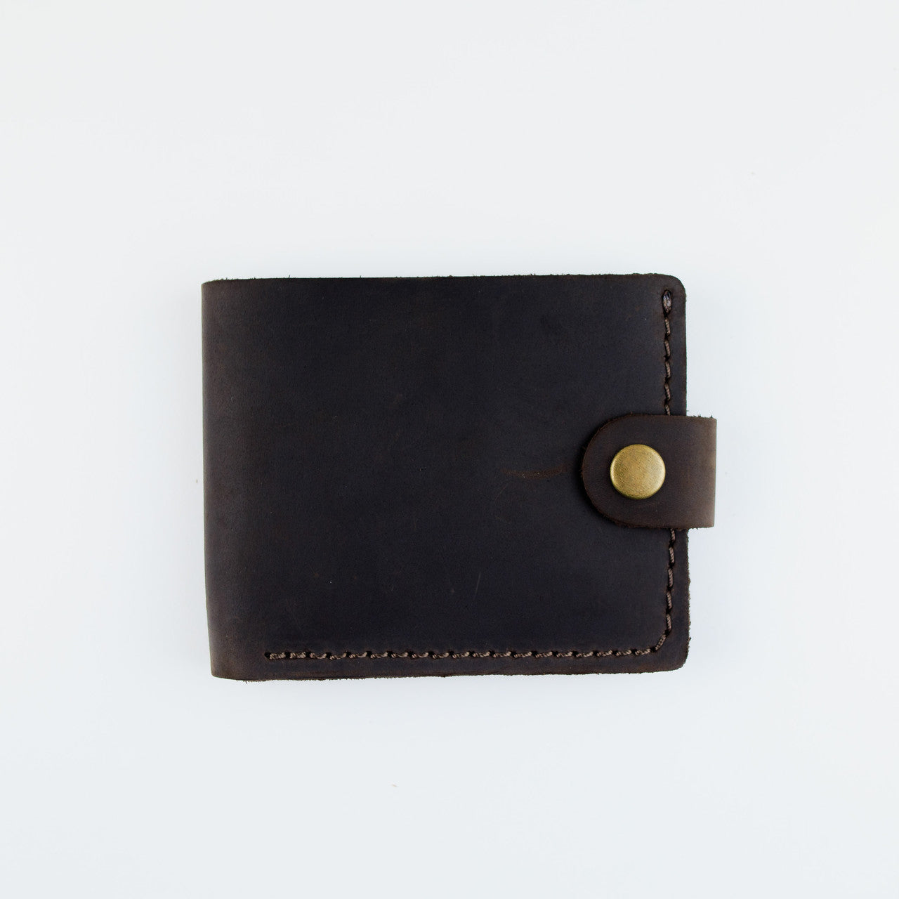 A dark brown leather bifold wallet with a snap-button closure, shown flat against a plain white background.