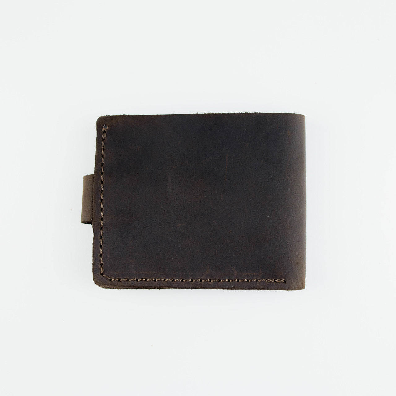 A dark brown leather bifold wallet with visible stitching and a small leather tab on the left side, photographed flat against a plain white background.