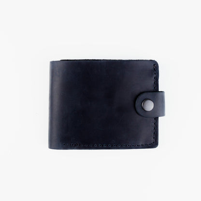 A black leather bifold wallet with a snap-button strap closure, shown closed on a plain white background.