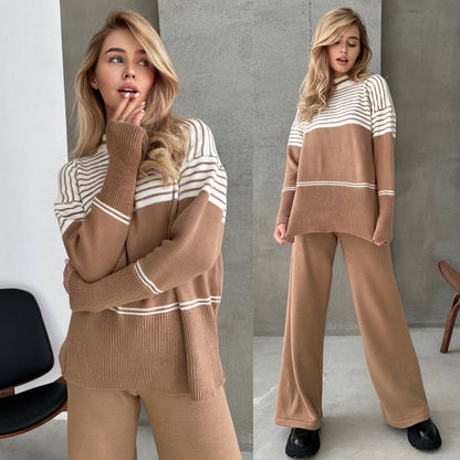 Woman wearing a brown and white striped sweater with matching pants in a minimalistic setting.