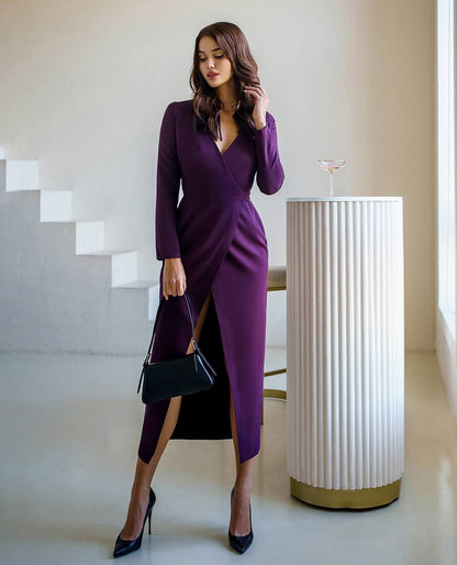 Woman in a purple dress standing in an elegant interior setting
