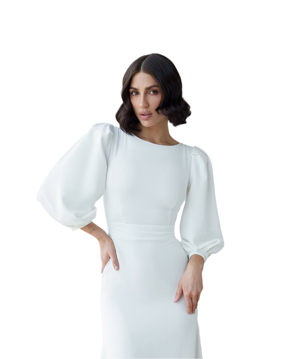 Woman wearing a white dress with puffed sleeves on a white background