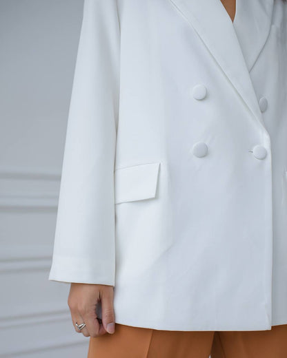 White blazer with a blurred background