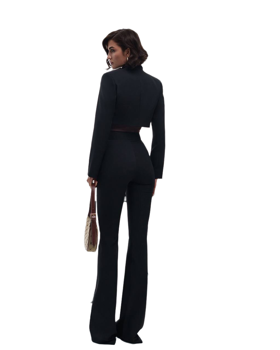 Woman wearing a black suit with a white background