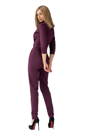 Woman wearing a purple jumpsuit on a white background