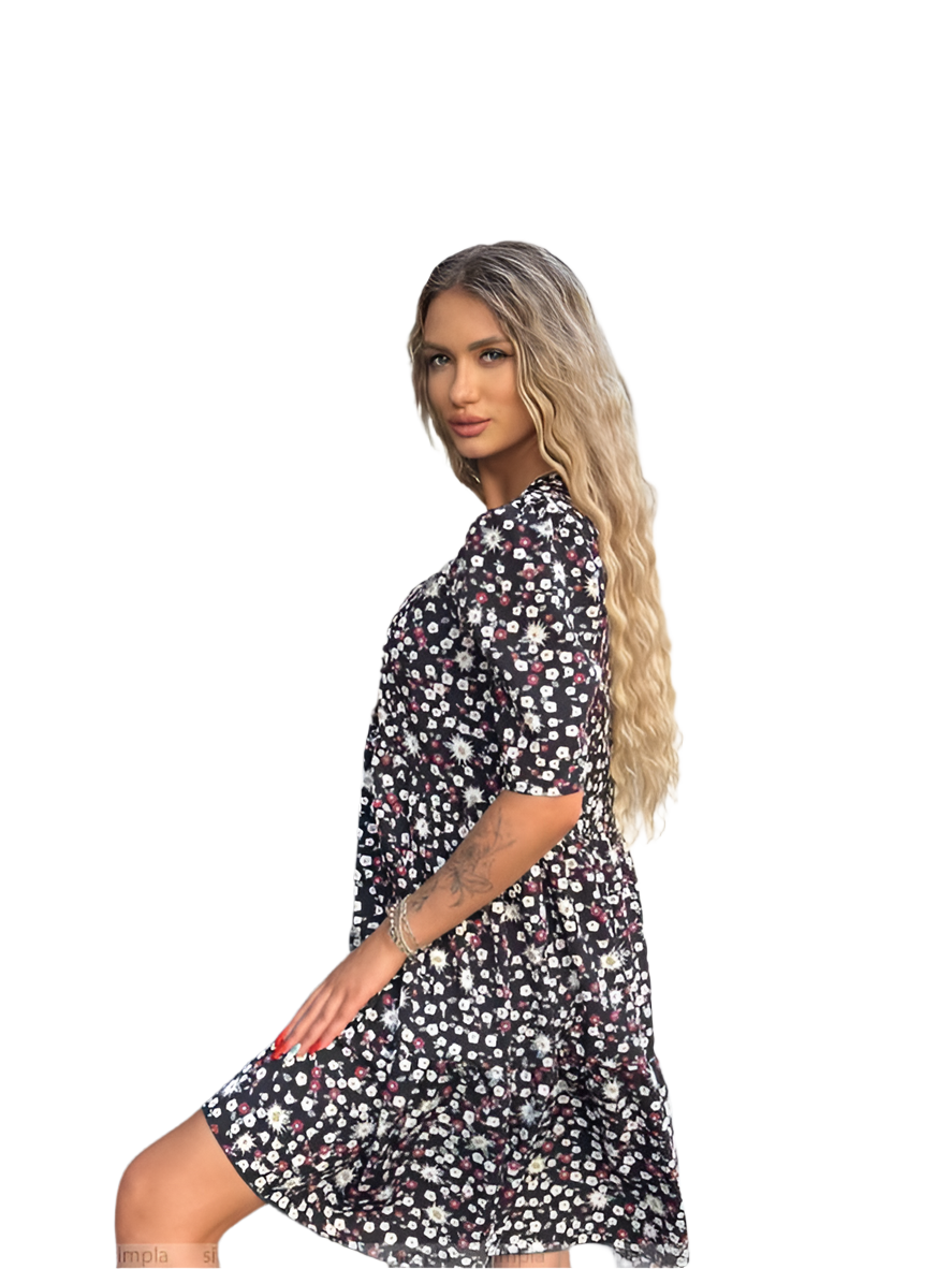 Woman wearing a black floral dress on a white background