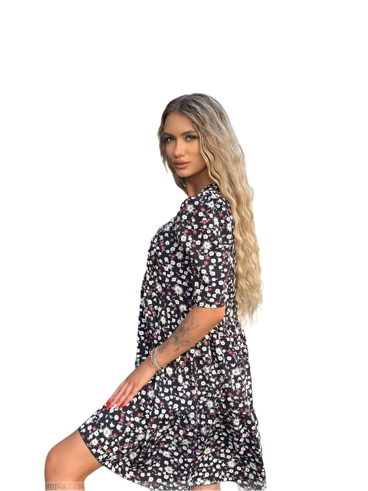 Woman wearing a black floral dress on a white background