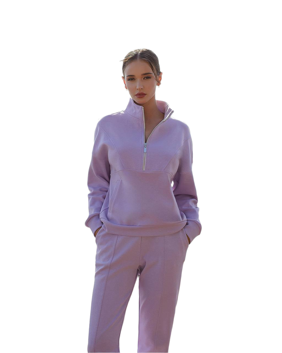 Woman wearing a lavender tracksuit on a white background