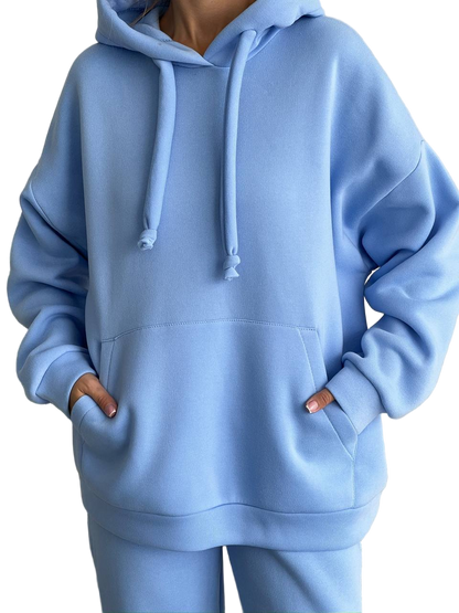 Light blue hoodie worn by a person on a white background